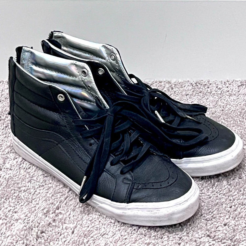 Vans High Top Sneakers in Black with Silver Tongue